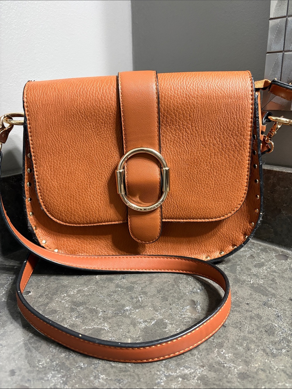 Poppy & Peonies Sienna Saddle Crossbody in Cognac Orange with Gold Ring